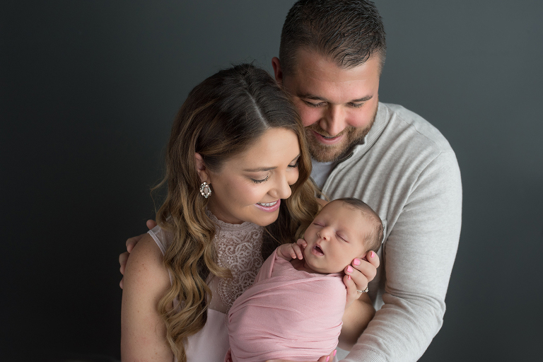 Newborn family photo with mom, dad and baby
